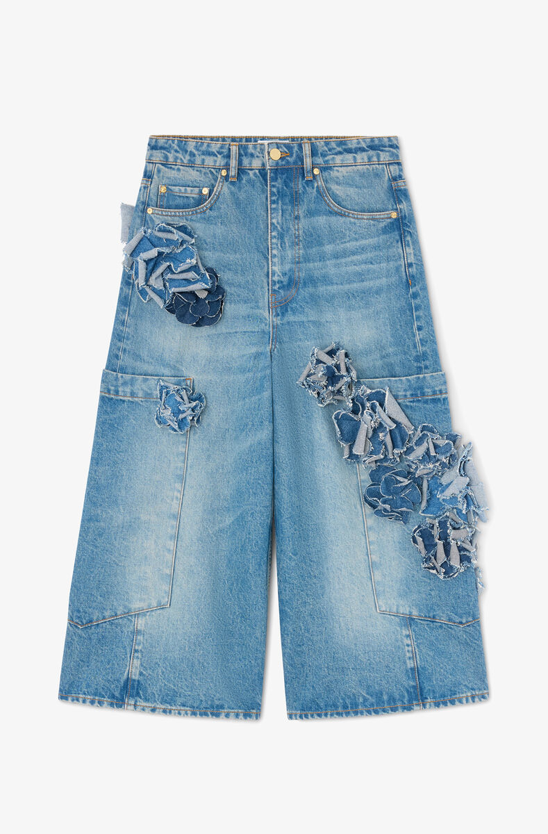 Calças jeans justas com estampa floral em denim rígido